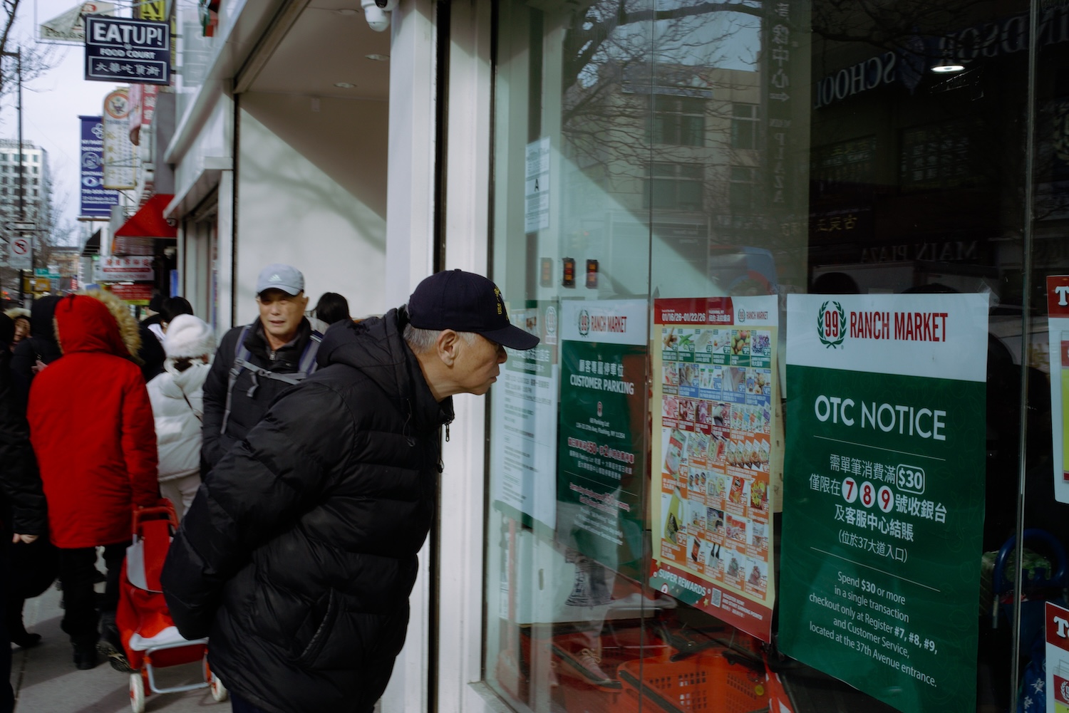 Man Reading Posters